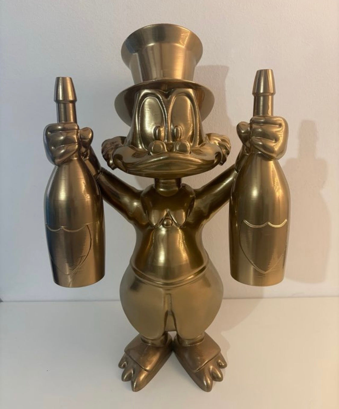 Scrooge Mc Duck Statua 3D Oro con Champagne Dom Pèrignon
